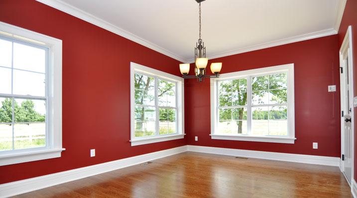 ICH Builders Mt. Sterling residence custom build dining area with dark red painted walls and white crown molding